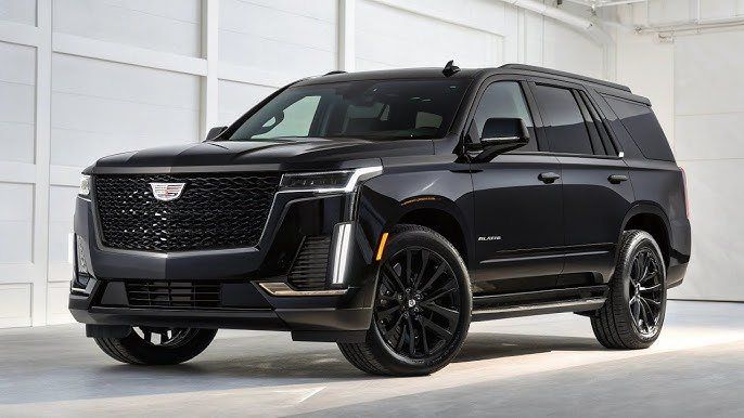 Black Cadillac Escalade in a bright studio