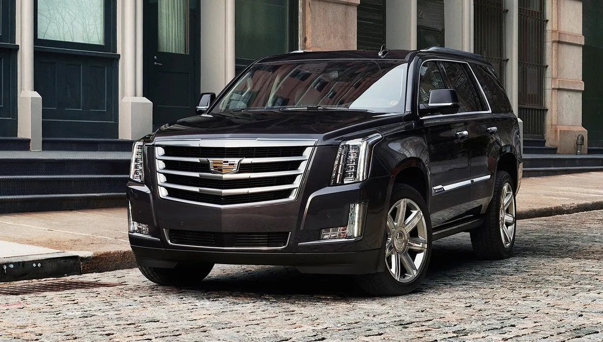 Black Cadillac Escalade ESV ready for a private aviation pickup