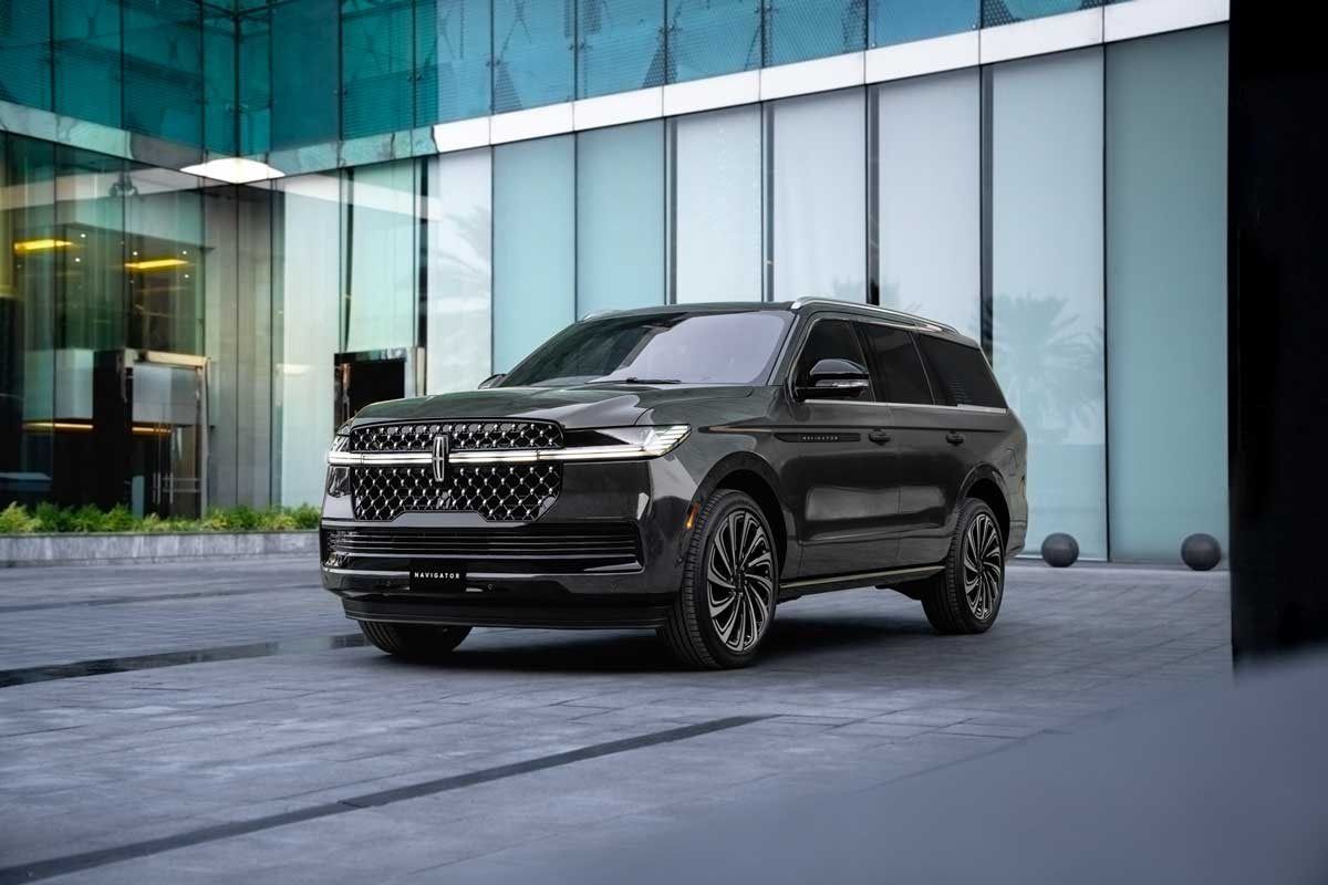 Black Lincoln Navigator outside a modern building