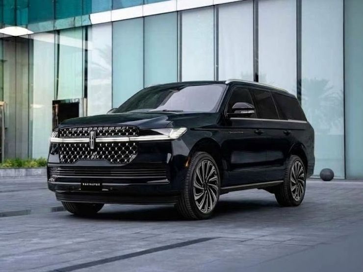 Black Lincoln Navigator parked outside a modern glass office building