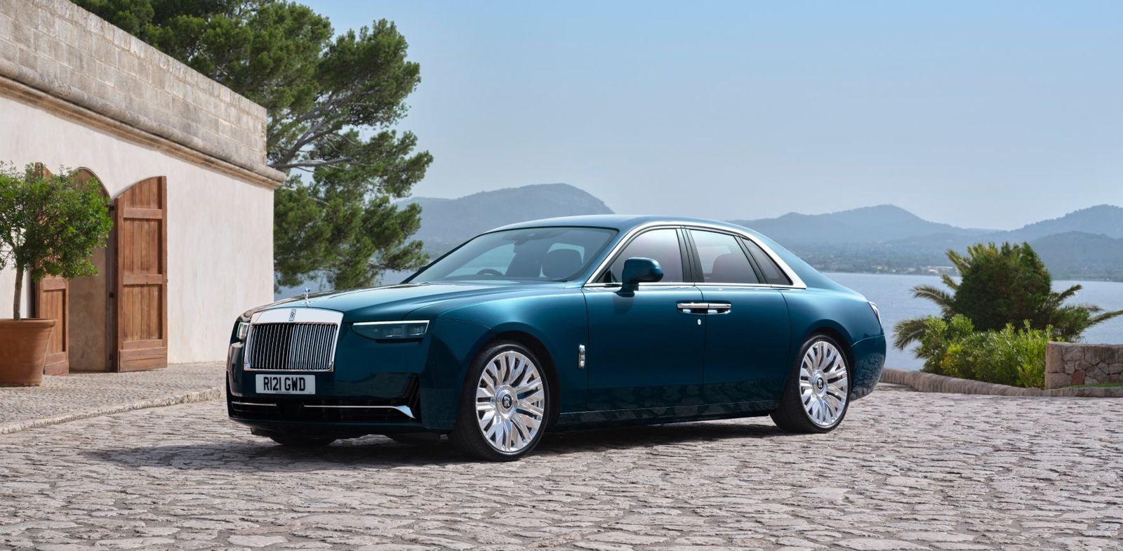 Rolls-Royce arriving at a waterfront villa for a wedding